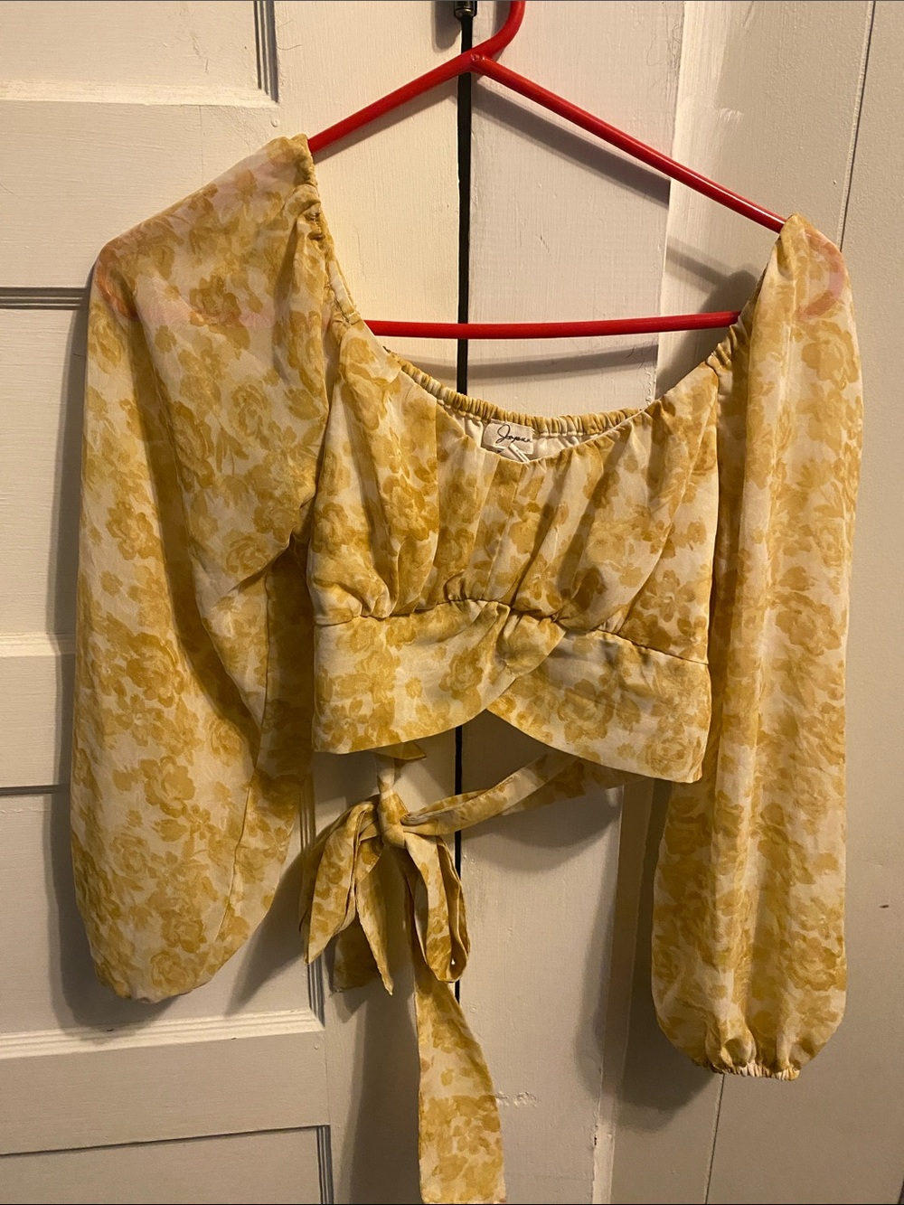 J.O.A. Yellow Floral Tie-Front Puff Sleeve Crop Top ties in the back.